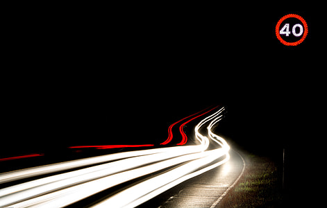 time laps photography of cars at the road during night thumbnail