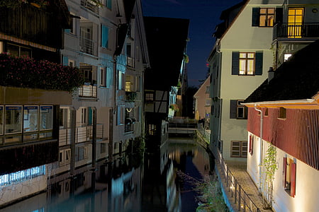 river between houses thumbnail