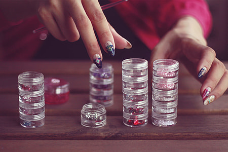 person touching glass tubes thumbnail