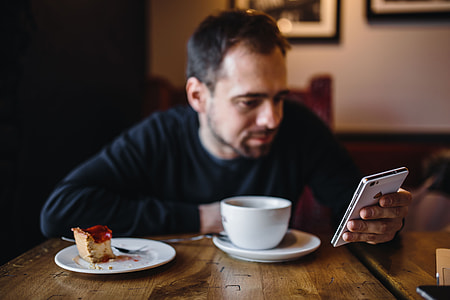 Young Elegantly dressed man sititng in a cafe thumbnail