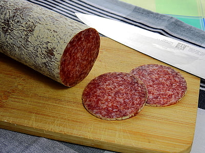 meat slices on top of brown wooden chopping board thumbnail