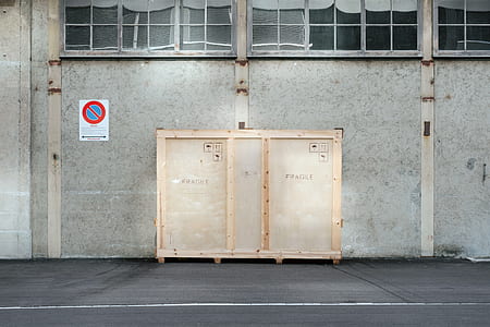 beige wooden storage box near gray concrete wall thumbnail