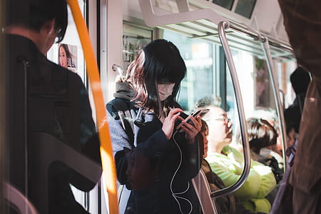 woman browsing her phone in train thumbnail