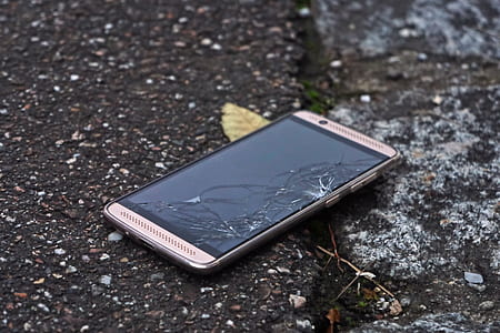 silver Android smartphone on ground thumbnail