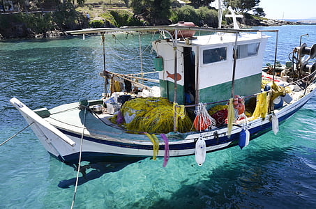 boat with fenders on body of water by day thumbnail