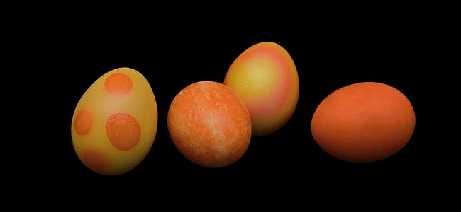 close-up photo of four orange and yellow eggs thumbnail