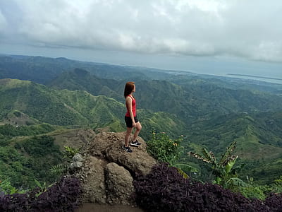 woman on cliff mountain thumbnail