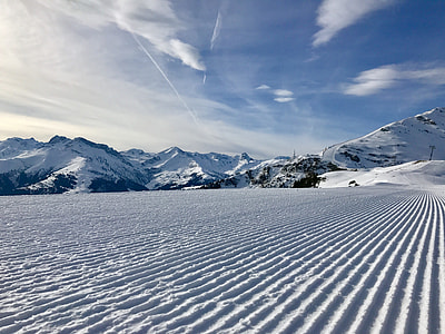 landscape photography of snow coated ground and mountains thumbnail