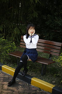 woman sitting on bench thumbnail
