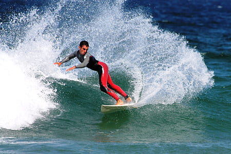man surfing on white surfboard thumbnail