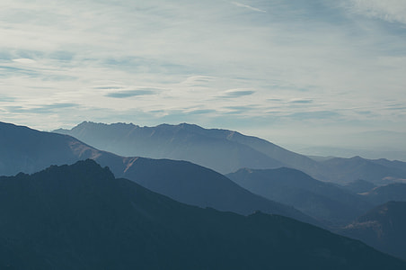 mountain under cloudy sky during daytime thumbnail