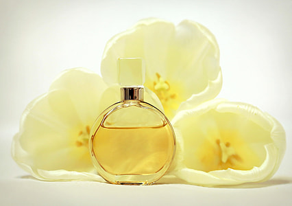 perfume spray bottle beside white flowers thumbnail