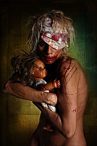 topless woman hugging doll wallpaper thumbnail