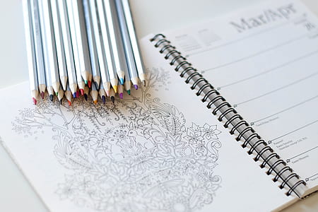 assorted-color pencil lot on ruled notebook thumbnail
