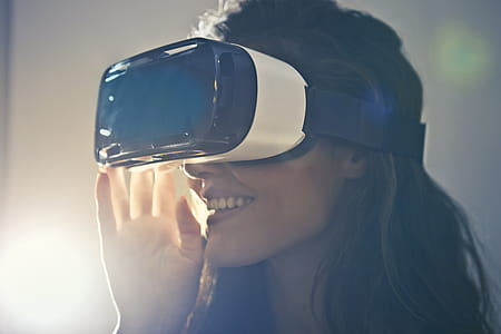 Man Wearing White Virtual Reality Goggles thumbnail