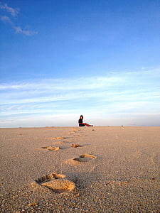 person sitting on white sand thumbnail