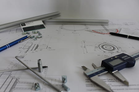 black digital caliper on drawing plates thumbnail