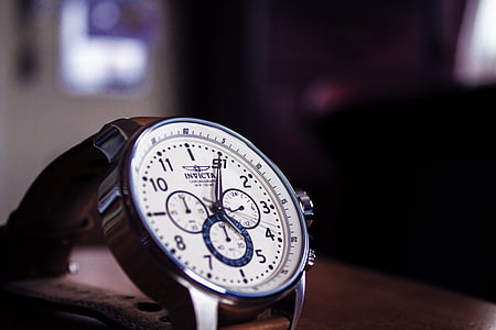 round white chronograph watch at 5:04 thumbnail