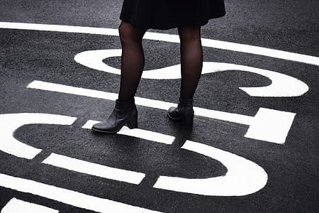 person standing on stop road sign thumbnail