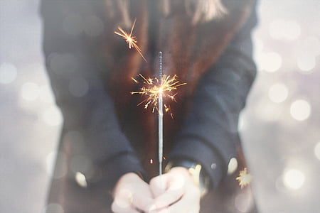 person holding lighted firecracker thumbnail