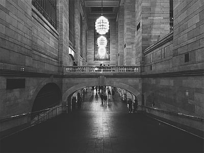 people walking on concrete structure hallway thumbnail