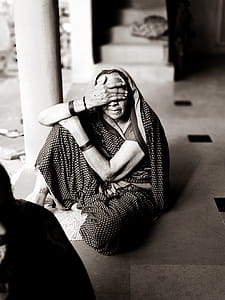 Gray Scale Photo of Woman Seat on Floor thumbnail