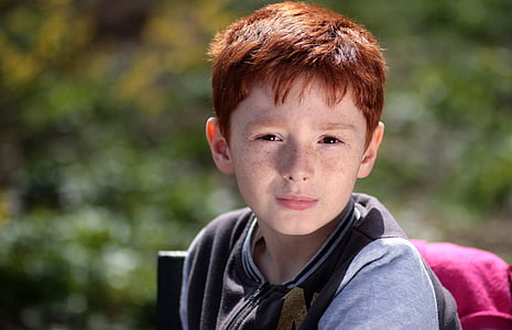 boy wearing gray zip-up jacket thumbnail
