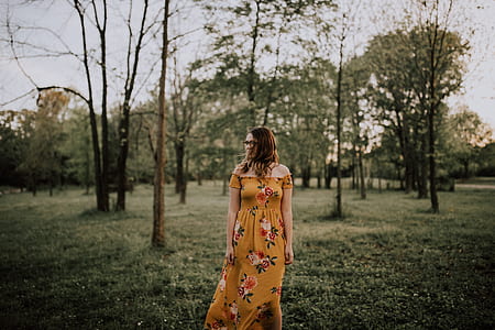 woman standing with trees background thumbnail