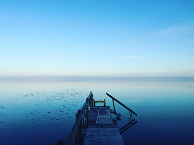 wooden dock on in body of water thumbnail