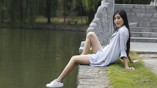 woman sitting on bridge thumbnail