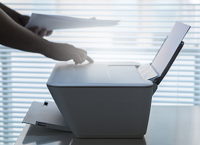 person using white desktop printer thumbnail