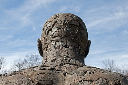 gray concrete head bust during daytime thumbnail