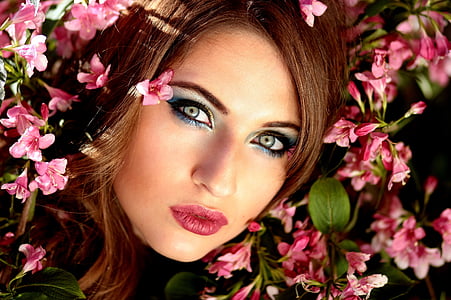 woman in pink lips surrounded with pink flowers thumbnail