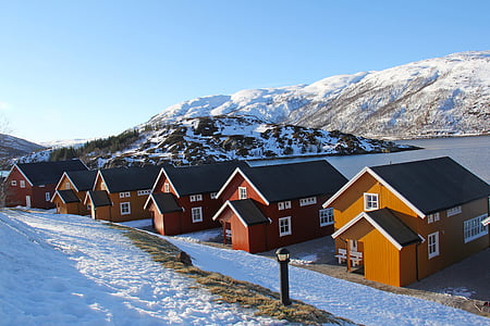 house near snowy mountain thumbnail