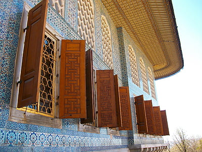 brown wooden window doors during daytime thumbnail