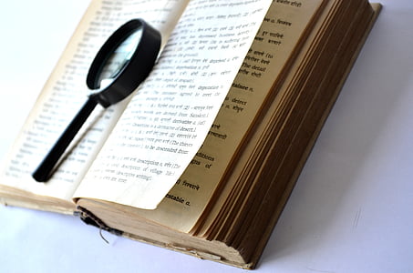 opened book and magnifying glass thumbnail
