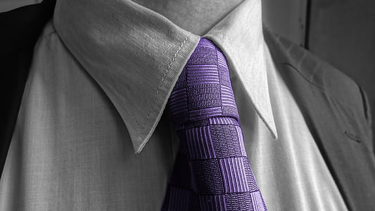 selective color photo of person wearing purple necktie and suit jacket thumbnail