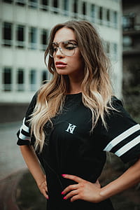 woman standing beside building thumbnail