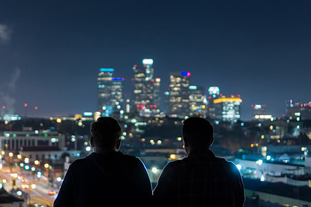 Two men viewing the city at night thumbnail