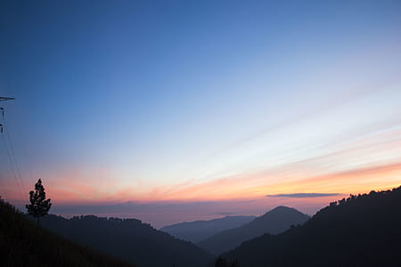 silhouette of mountain during golden hour thumbnail