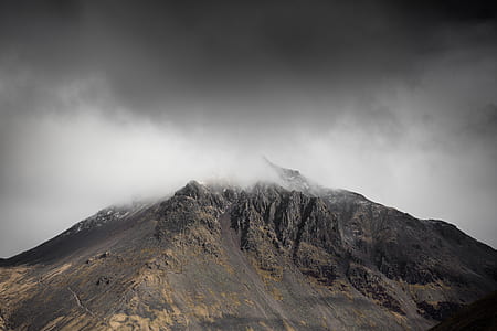 aerial photography of mountain with clouds at daytime thumbnail