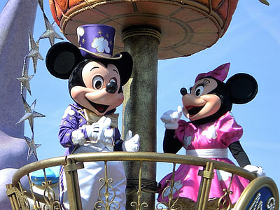 Disney Mickey and Minnie Mouse mascots under blue sky thumbnail