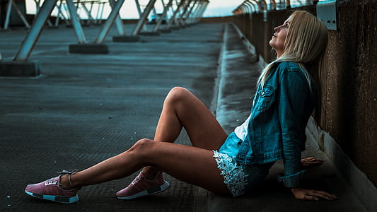woman sitting on a gray gutter thumbnail