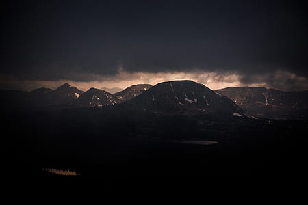 mountain rage view under cloudy sky during daytime thumbnail