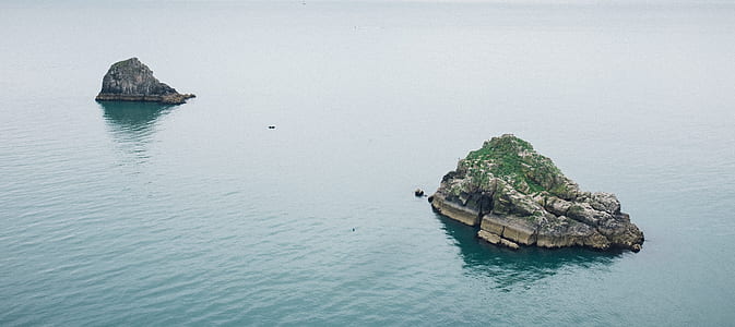 two islet surrounded by body of water thumbnail