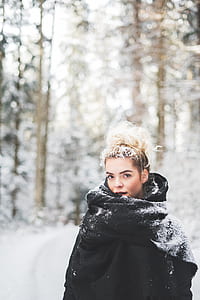 woman wearing black coat standing on snow thumbnail