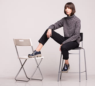 woman sitting on chair feet on chair thumbnail