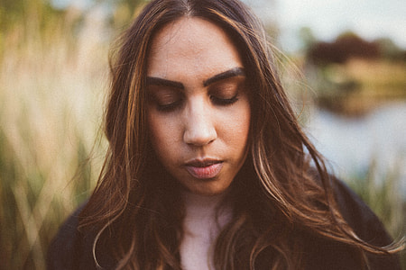 closeup photo of woman wearing black collared top thumbnail