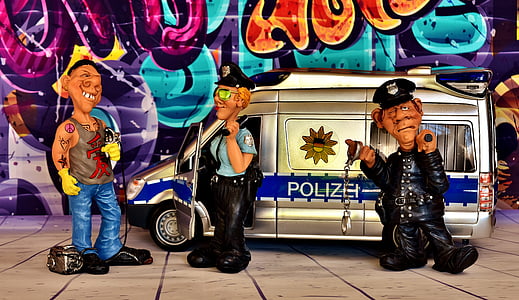 three men and gray police vehicle figurines thumbnail