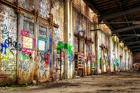 brown concrete wall with graffiti paints thumbnail